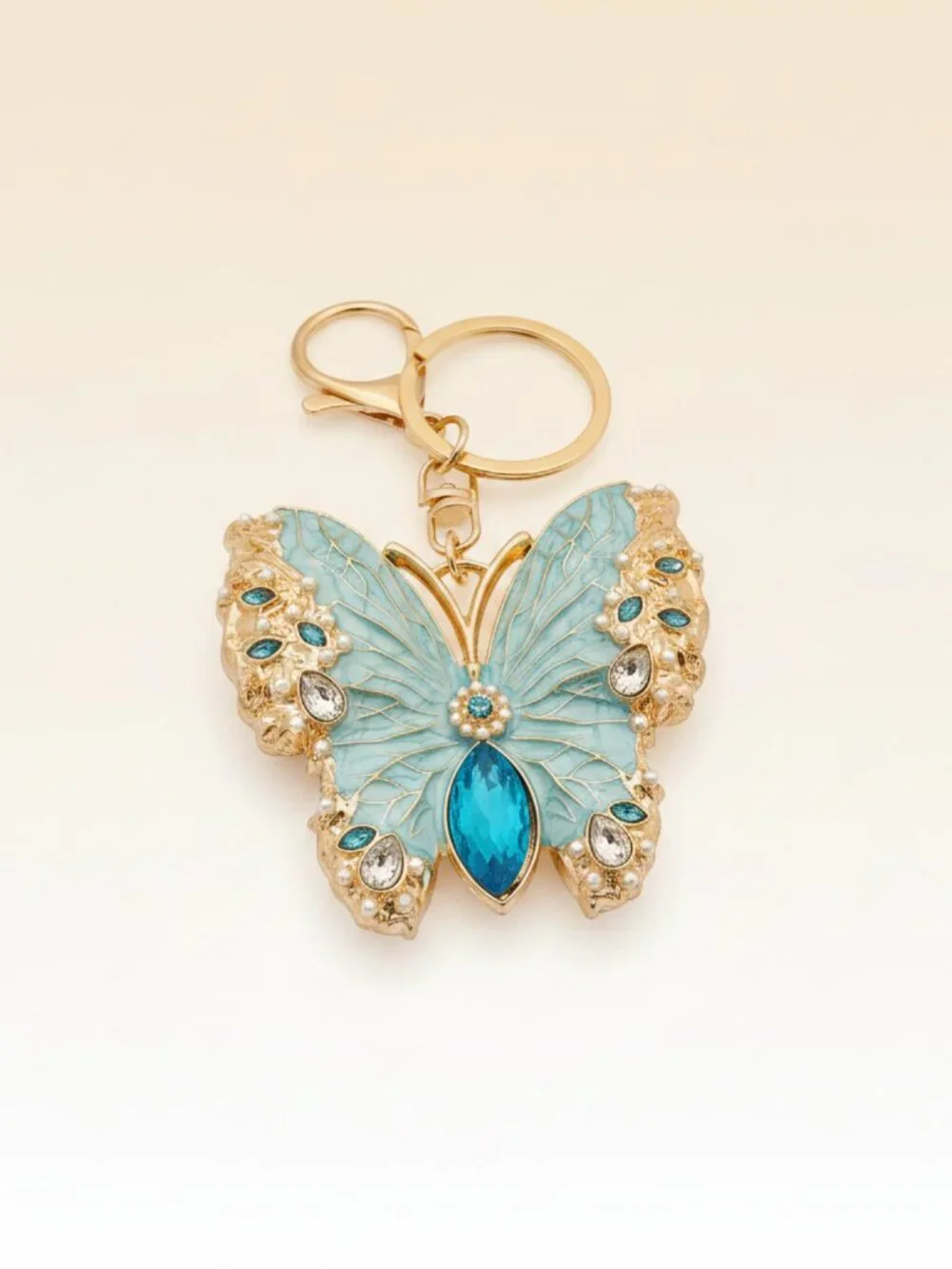 Bling Butterfly Rhinestone Keychain/Charm/Brooch. Brand new. Light Blue.